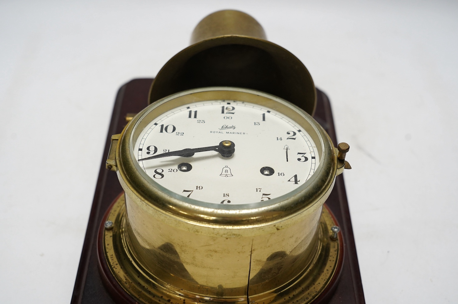 A mounted Schatz Royal Mariner brass clock, 21cm wide, 34cm high. Condition - untested for time keeping